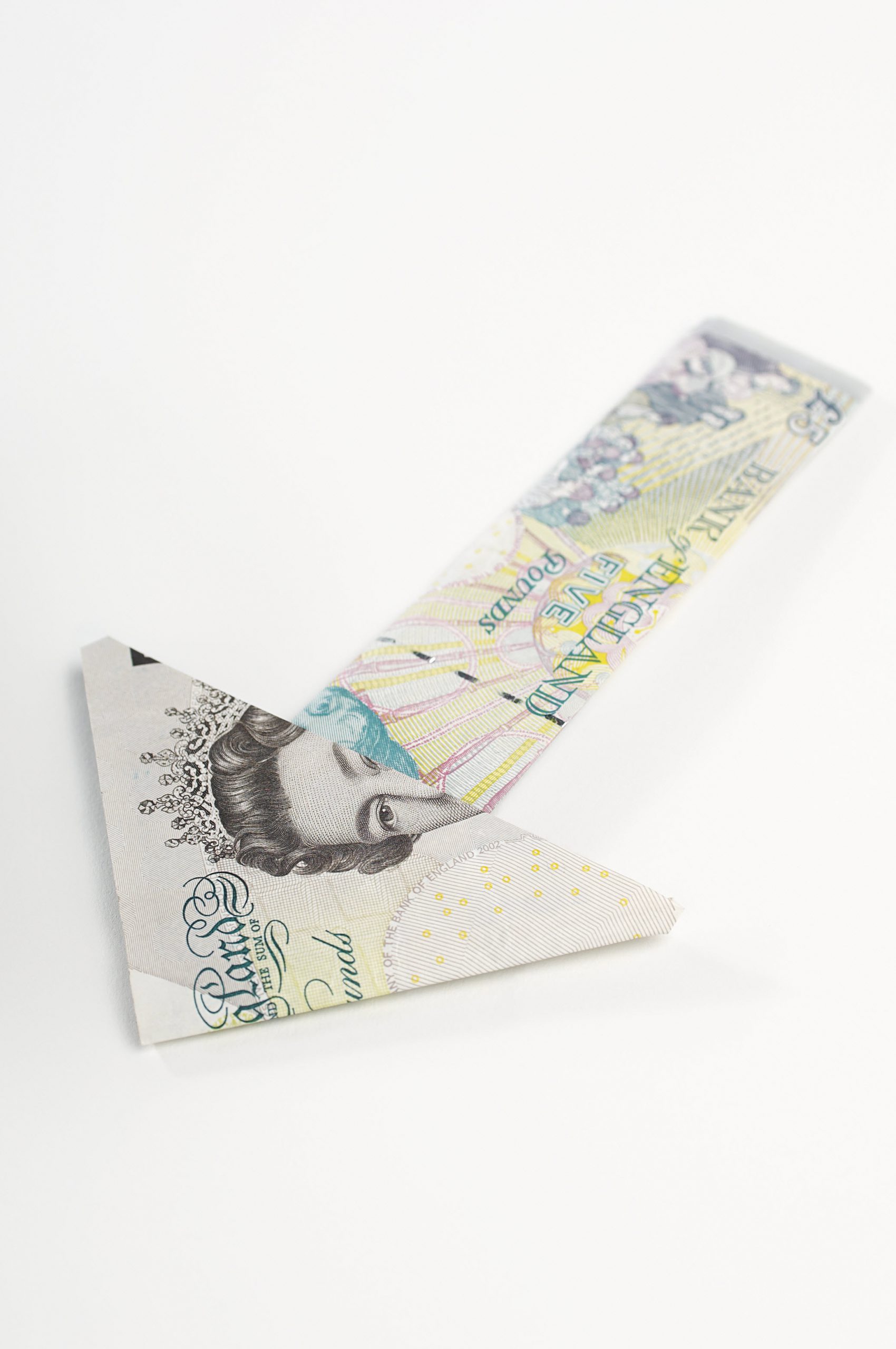 Arrow made of folded banknotes