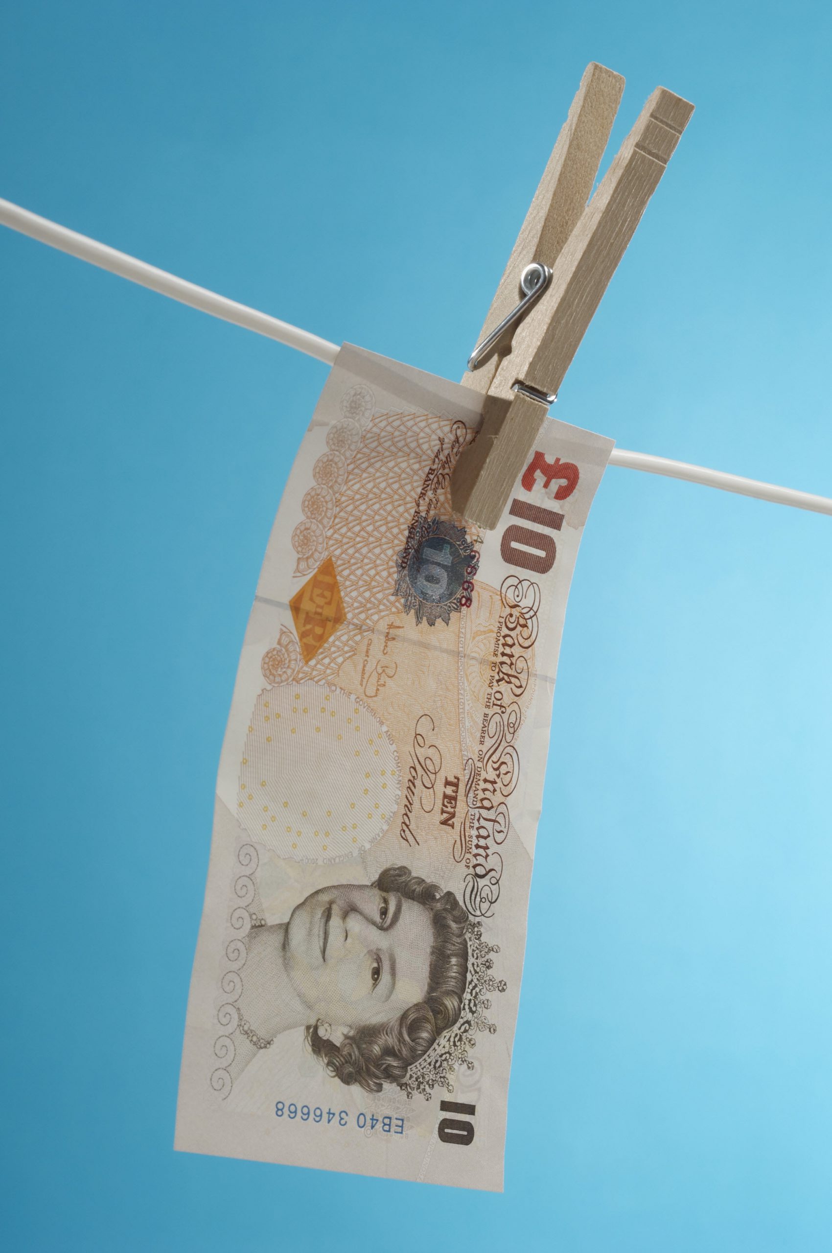 British paper currency on clothesline